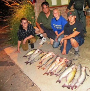 El Cajon's Brian, Daniel and Grace Martin teamed with Chris Flor to catch 15 catfish totaling 60 pounds, using mackerel. (LAKE JENNINGS) 