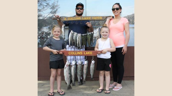 John and Kim with their little girls Kylah and Hailey, with four limits of trout. 