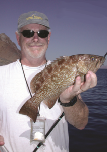 Dr. Larry Allen with a leopard grouper