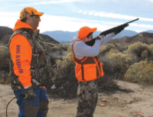 During the target session, an instructor gives some tips to a new hunter. Author Tim Hovey says one of the most challenging aspects of shooting is hitting a ?ying target above. (TIM E. HOVEY) Gun 