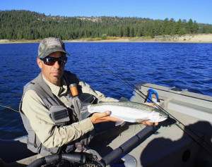 Author Jon Baiocchi with an average Davis Lake rainbow, healthy fish that measure about 18 to 20 inches. (LANCE GRAY) 