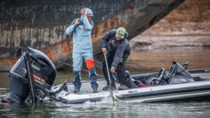 Kline (left) lands a bass during an FLW tournament, where he’s won four events and was co-angler of the year in both 2013 and 2014. (COLIN MOORE/FLW) 