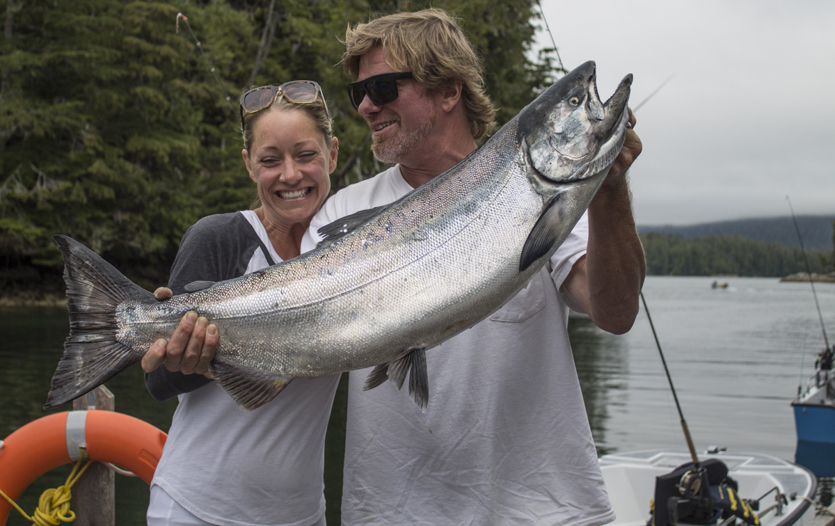 Rivers Inlet Sportsman’s Club owner Simon and his wife Stephanie with a trophy “tyee,” a Chinook of 30 pounds or more, caught August 5. (RIVERS INLET)