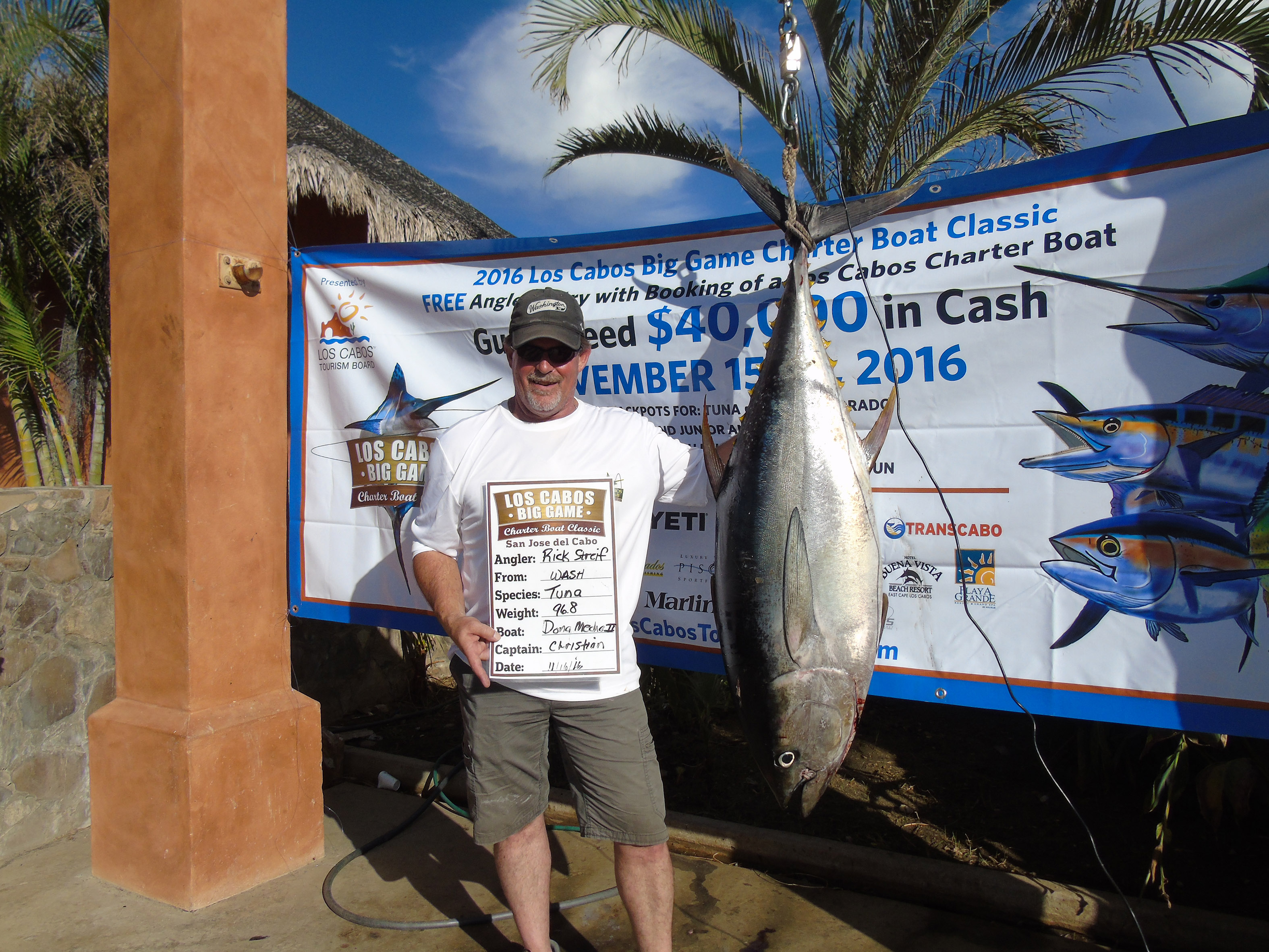 Rick Streif of team Dona Meche II poses with his 96.8-ppund tuna, which took home the second place prize in its category on day two. (Bonnier Corporation)